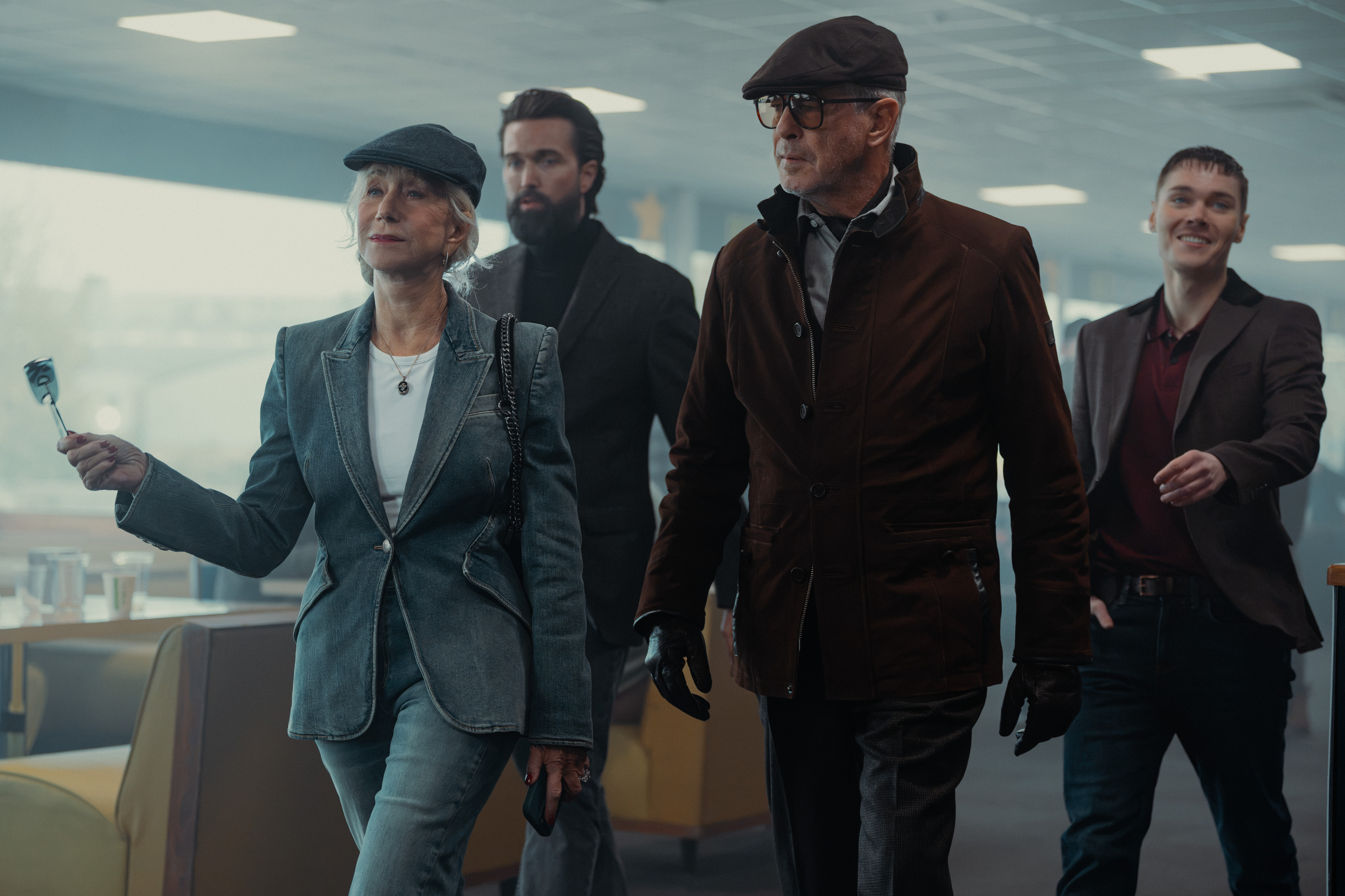 L-R Helen Mirren as Maeve Harrigan, Emmett J Scanlan as Paul, Pierce Brosnan as Conrad Harrigan and Jack Archer as Fergus In MobLand, season 2,
